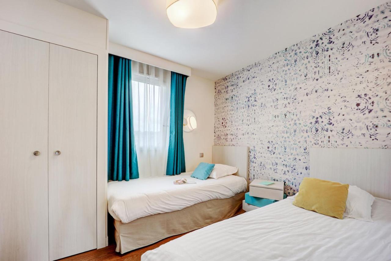 Residence Pierre & Vacances Premium Presqu'Ile De La Touques Deauville Exterior foto A typical bedroom at the hotel